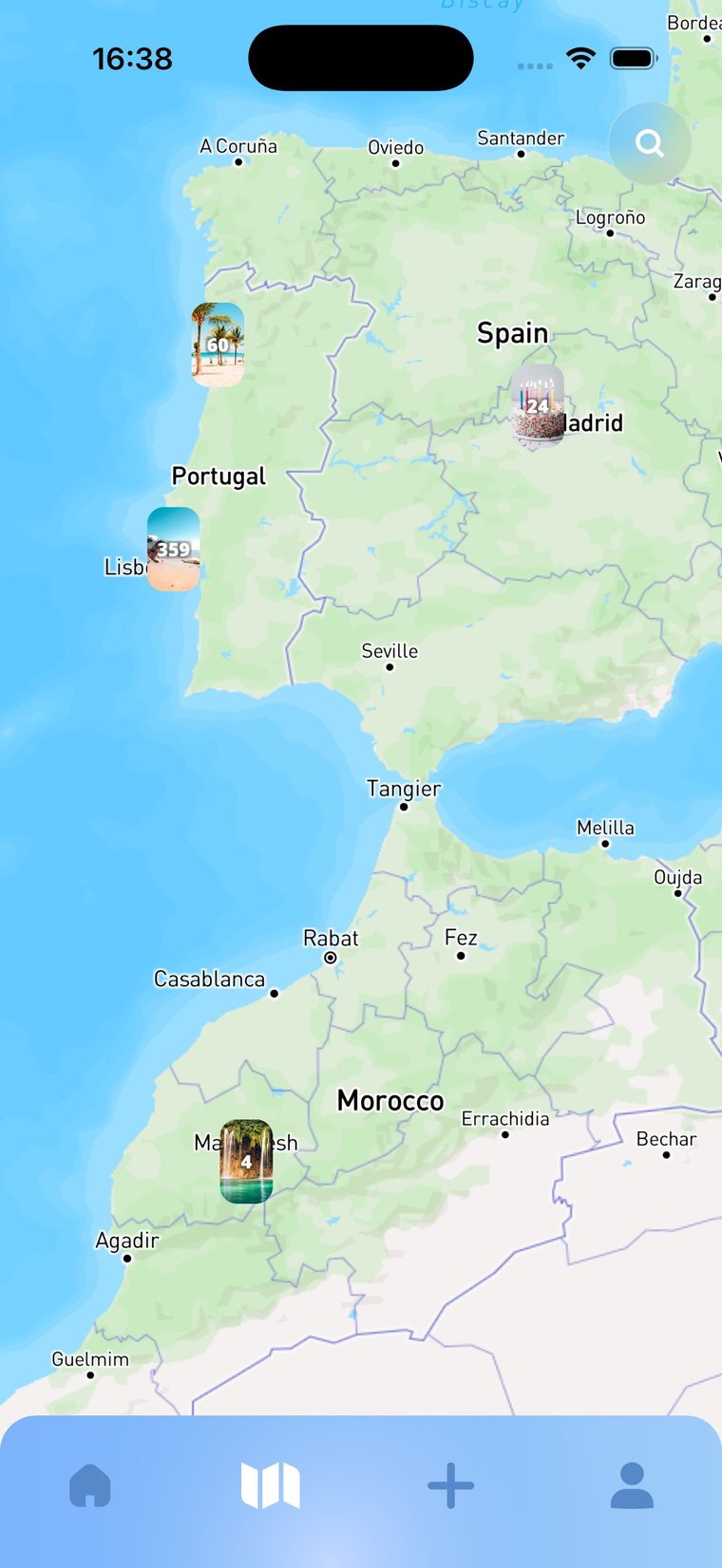 A world map inside Life Tabs with photos pinned where they were taken